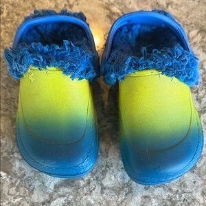 Kids Blue and yellow Shoes like crocs but not.